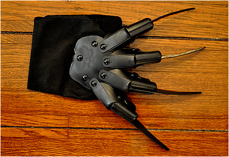 Straight out of A Nightmare on Elm Street, it's the blackest black Freddy Krueger glove you'll ever find!