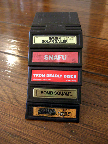 A pile of Intellivision games! Tron: Solar Sailer, SNAFU, Tron: Deadly Discs, Bomb Squad, Masters of the Universe: The Power of He-Man!