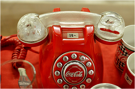 A Coke / Coca-Cola telephone with snowglobes in the handle!?