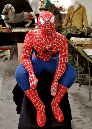 Spider-Man perched in a parking garage.