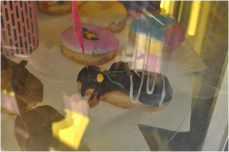 A bleeding voodoo doll donut.