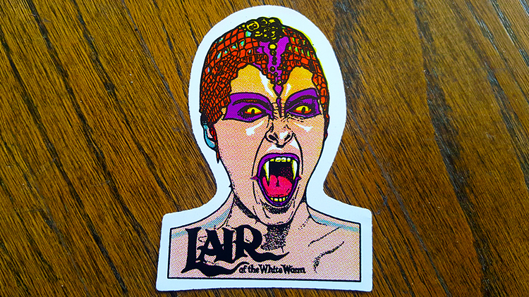 The Lair of the White Worm vintage horror prism vending machine sticker!