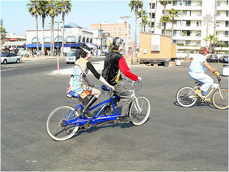 CHEWING GUM AND RIDING DOUBLE BIKES IS THE ROCKABILLY WAY OF LIFE