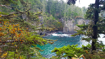 Tall cliffs and blue waters all around.