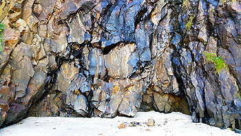 The large rock cliffs on the southern side of Crescent Beach – 'The Cliffs of Insanity'.