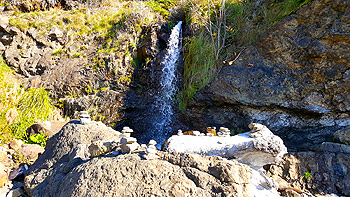 Discovering a hidden waterfall for Re on the northern side of Crescent Beach.
